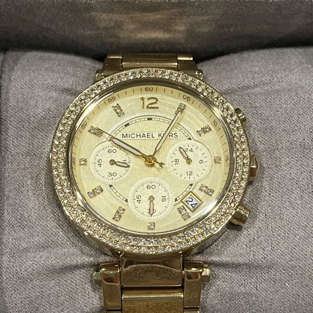 Michael Kors jeweled gold colored watch with box, bag, pillow needs batteries